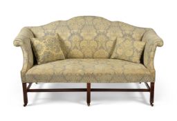 A GEORGE III CAMELBACK AND DAMASK UPHOLSTERED SOFA, CIRCA 1780