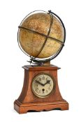 A WALNUT TERRESTRIAL GLOBE MANTEL TIME PIECE, UNSIGNED, GERMAN, CIRCA 1905