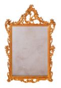 AN ORNATE CARVED WOOD WALL MIRROR, ITALIAN