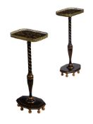 A PAIR OF BLACK AND GILT PEDESTAL SIDE TABLES, IN REGENCY STYLE, 20TH CENTURY