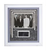 BUDDY HOLLY, A FRAMED DISPLAY INCORPORATING A SIGNED PHOTOGRAPH OF BUDDY HOLLY AND THE CRICKETS