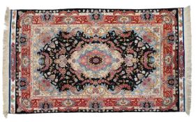 A QUM SUPERFINE WOOL AND PART SILK RUG