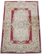 A LARGE AUBUSSON CARPET