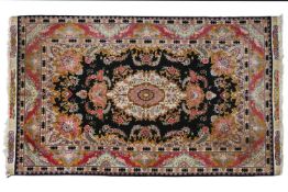 A SUPERFINE QUM WOOL AND SILK PILE RUG