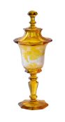 A BOHEMIAN AMBER FLASHED GLASS GOBLET AND COVER, MID 19TH CENTURY