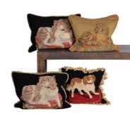 A GROUP OF FOUR TAPESTRY STYLE CUSHIONS DEPICTING SPANIELS