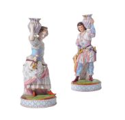 A PAIR OF FRENCH BISQUE PORCELAIN FIGURAL CANDLESTICKS, MID 19TH CENTURY