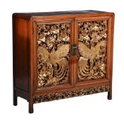 A CHINESE CARVED HARDWOOD AND PARCEL GILT CABINET, 20TH CENTURY