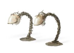 A PAIR OF METAL TABLE LAMPS WITH NAUTILUS SHELL SHADESLATE 20TH CENTURYFitted for electricity40cm