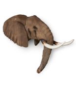 A RESIN CAST OF AN ELEPHANT HEAD, MODERN