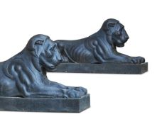 A PAIR OF PAINTED STONEWARE MODELS OF RECUMBENT EGYPTIAN LIONS, MODERN