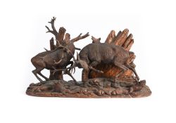 ERNST HEISL (1828-1899), A LARGE BLACK FOREST CARVED WOOD GROUP OF FIGHTING STAGS, CIRCA 1900
