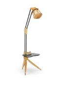 AN EBONISED, BEECH AND BRASS MOUNTED FLOOR LAMP