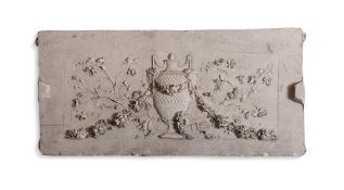 A PLASTER PANEL OF A CLASSICAL URN DRAPED WITH FLORAL SWAGS
