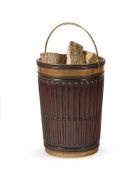 A BRASS MOUNTED FLUTED MAHOGANY LOG BUCKET, MODERN