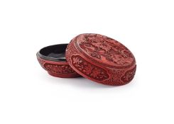 A large Chinese cinnabar lacquer circular box and cover