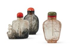 Y Two Chinese rutilated quartz snuff bottles