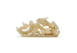 A Chinese celadon jade 'Dragon' brush rest