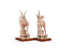 A large and impressive pair of Chinese pottery figures of Earth Spirits