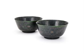 A large pair of Chinese green hardstone bowls