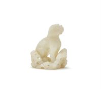 A Chinese pale celadon jade carving of a standing beast
