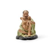 A Chinese seated porcelain of luohan