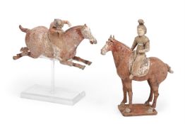 A Chinese painted pottery equestrian figure of a polo player