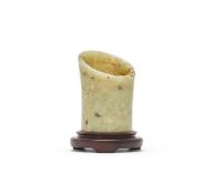 A Chinese celadon jade hoof-shaped ornament