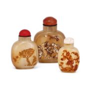 Three Chinese agate snuff bottles and stoppers