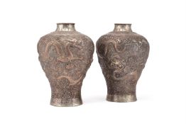 A good pair of Chinese silver 'Dragon' vases