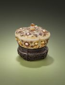 A pale celadon or white jade gem-set quatrefoil box and cover