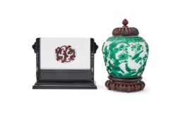 A Chinese green overlaid white glass vase