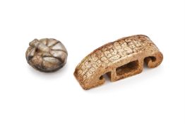 A Chinese archaistic brown jade carving of sword fitting