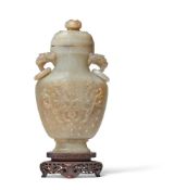 A Chinese pale celadon jade vase and cover