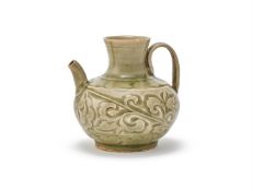 A rare small carved 'Yaozhou' ewer