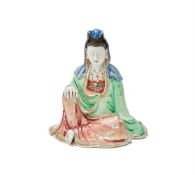 A rare Tang Ying style Famille Rose seated porcelain figure of Guanyin