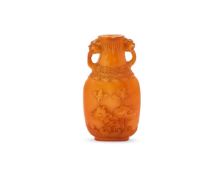A Chinese carved amber twin handled vase