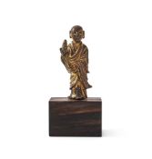 A rare Chinese gilt-bronze figure of a Lohan