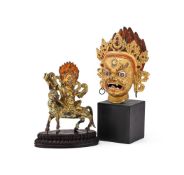 A Sino-Tibetan gilt bronze head of a Dharmapala