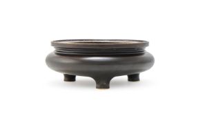 A Chinese bronze tripod censer