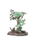 A Chinese jadeite group of birds on inlaid white metal stand