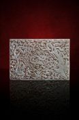 A large Chinese white jade reticulated dragon plaque