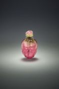 A finely carved Chinese pink and green tourmaline 'Lotus' snuff bottle