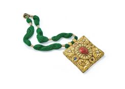 A Tibetan gem-set sheet gold metal pendant
