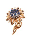 A MID 20TH CENTURY SAPPHIRE FLOWER BROOCH
