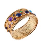 A GEM SET HINGED BANGLE