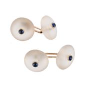 TRIANON, A PAIR OF ROCK CRYSTAL AND SAPPHIRE CUFFLINKS