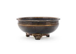 A Chinese brown glazed tripod censer