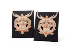 A pair of Chinese pottery guardian masks