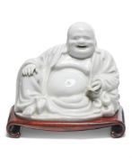 A Chinese Dehua figure of a Budai